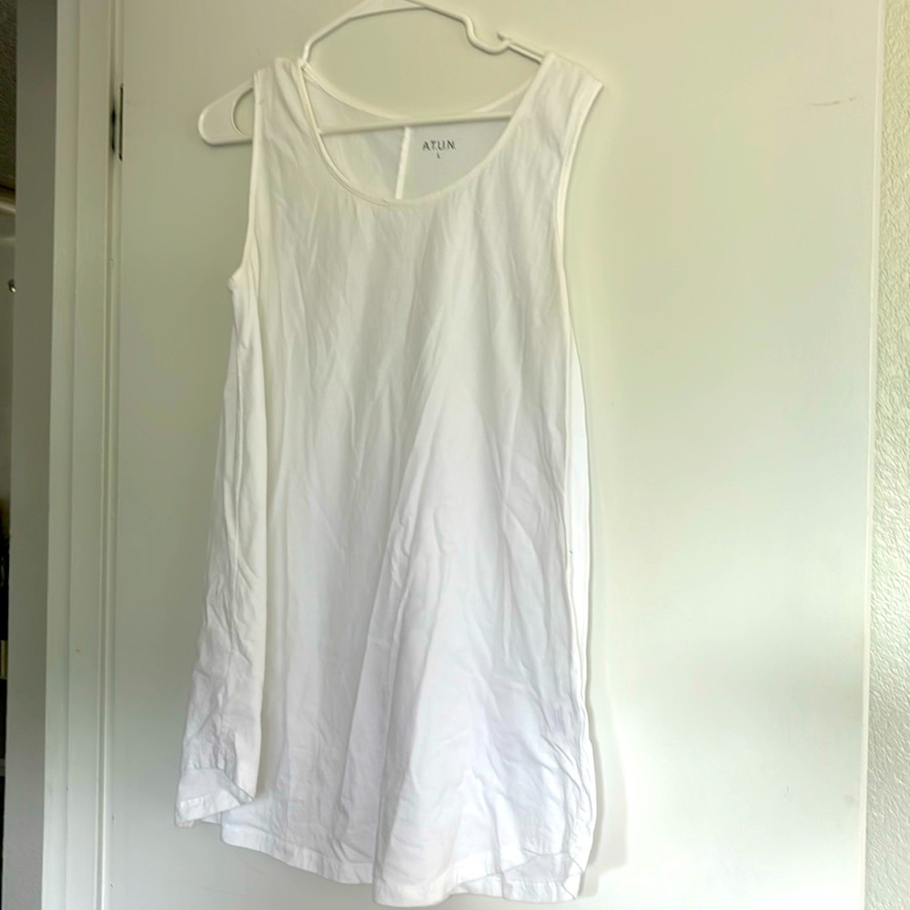 Gently loved White cotton tank; very flows at the waist.